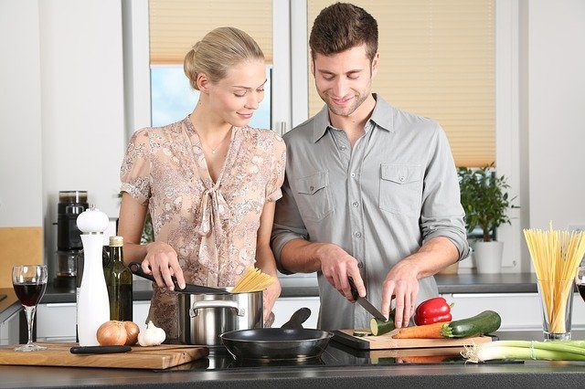 Man and woman cooking together