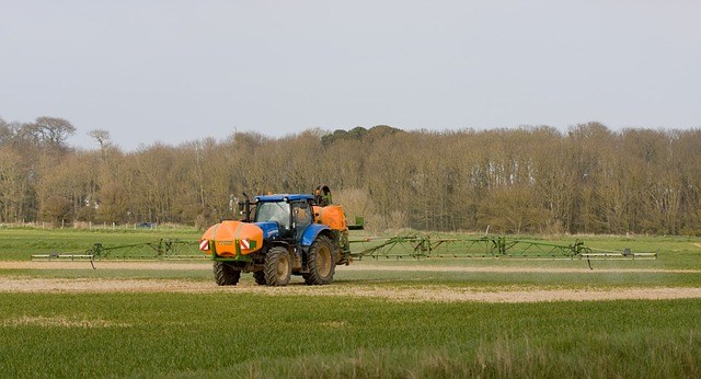 Tractor spraying the field
