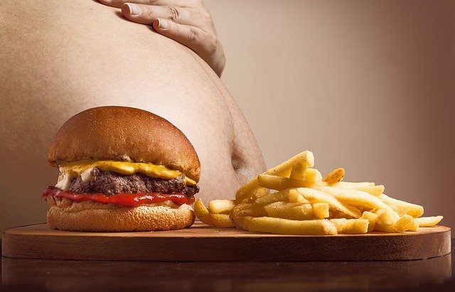 Hamburger, fries, and a big belly